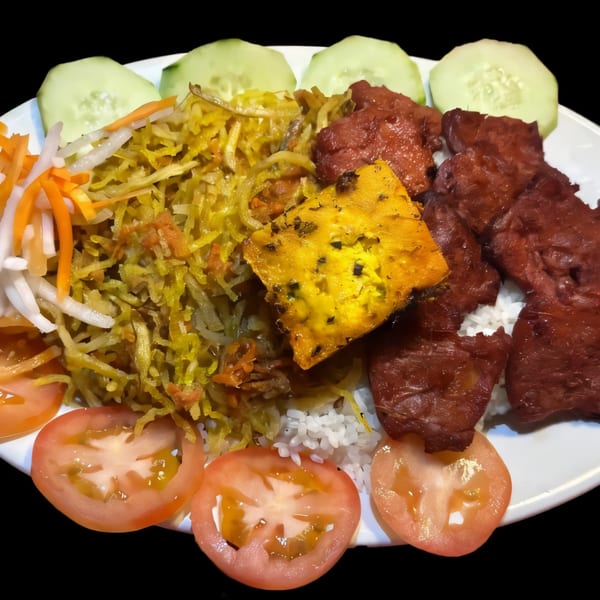 A vegan dish with rice, yellow noodles, red meat substitute, tofu, and fresh vegetables.